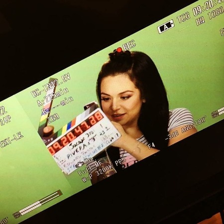 Jacqie Campos is posing for the photo.